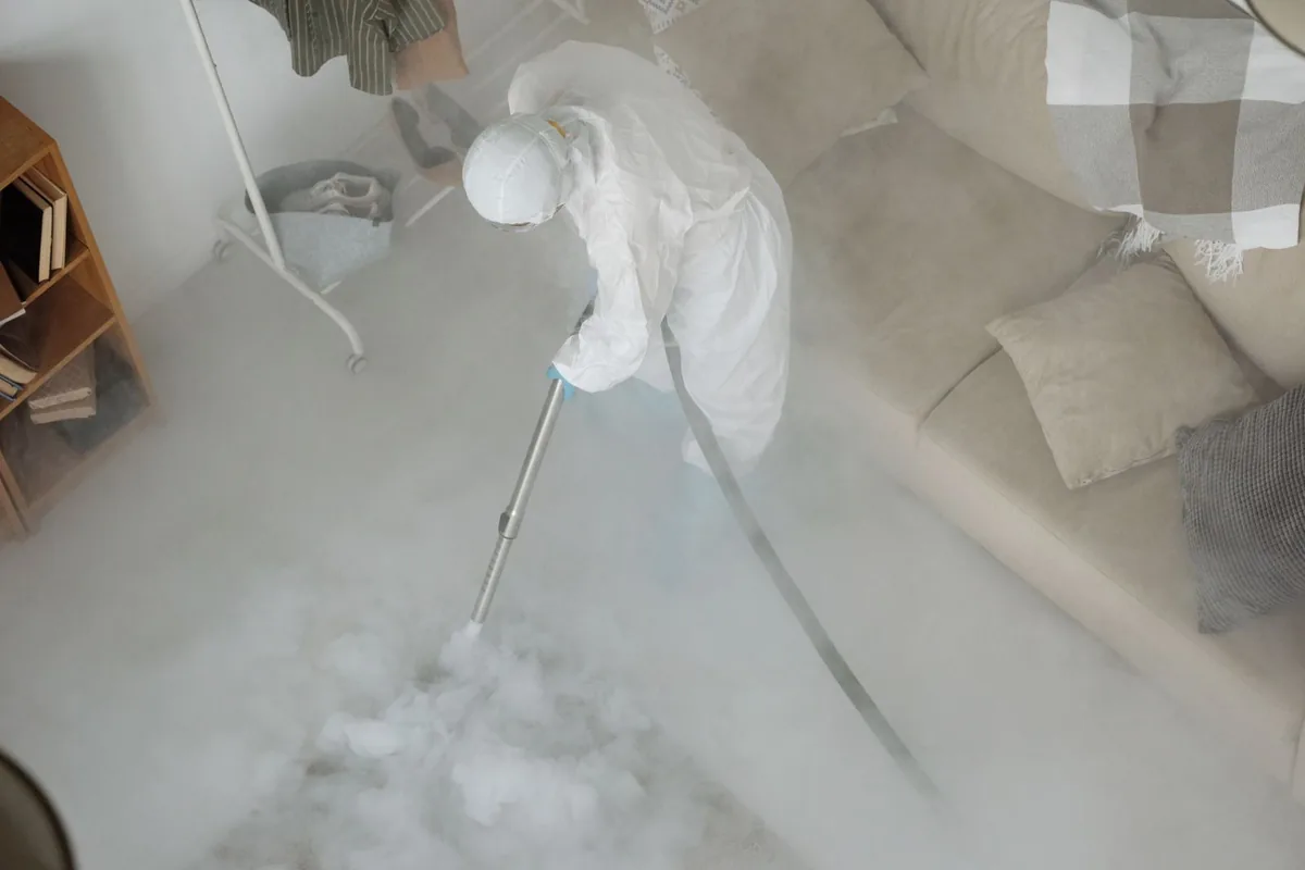 Biohazard cleanup technician in protective equipment, Crystal, MI